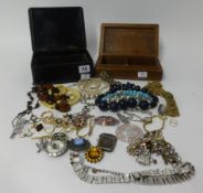 A collection of costume jewellery with in a carved box and a lacquer decorated box.