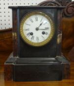 Victorian slate and marble mantle clock with bell strike and eight day movement height 23cm.