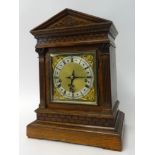 A 19th century German, chiming bracket clock, with architectural oak case, striking on a rack on