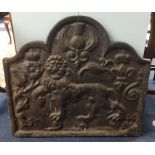 A heavy cast iron antique style fire back