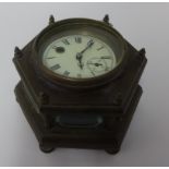 An old brass cased table clock, with key, diameter 23cm