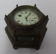 An old brass cased table clock, with key, diameter 23cm