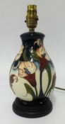 Moorcroft, a modern pottery table lamp decorated with lilies.