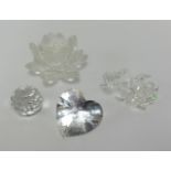 Swarovski, four pieces, flower, rose and two paperweights, boxed (4).
