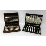 A twelve setting dessert set, comprising silver bladed and mother of pearl handles knives and