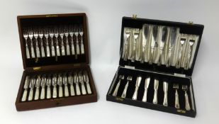 A twelve setting dessert set, comprising silver bladed and mother of pearl handles knives and