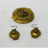 An antique pinchbeck group comprising brooch and a pair of earrings (3).