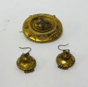 An antique pinchbeck group comprising brooch and a pair of earrings (3).