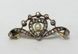 Diamond set heart and scroll design brooch, 40mm loing by 17mm (at widest)