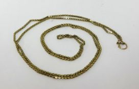 A 9ct long yellow metal guard chain, approx 15.5gms.