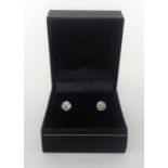 A pair of 18ct diamond ear studs, weighing approx 1.50cts overall.
