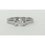 An 18ct diamond solitaire ring set in white gold, the stone approx 0.50cts, finger size J.