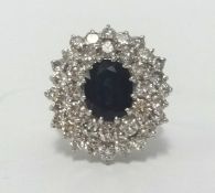 An impressive 18ct sapphire and diamond cluster ring, in white gold, finger size K.