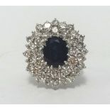 An impressive 18ct sapphire and diamond cluster ring, in white gold, finger size K.