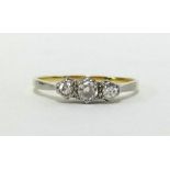 An 18ct three stone diamond ring, finger size T.