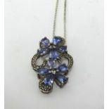 A tanzanite and silver set pendant on fine chain.