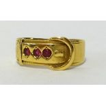 An 18ct ruby set buckle ring approx 4.2gms, finger size Q.
