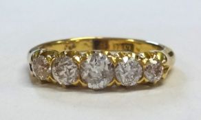 An Antique 18ct five stone diamond ring set with old cut diamonds, ring size P.