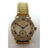 Smiths, a small vintage gents gold cased wrist watch with sub second dial.