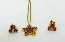 A modern Bangkok 18k gold and red stone pendant, together with a pair of similar 18ct ruby flower