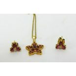 A modern Bangkok 18k gold and red stone pendant, together with a pair of similar 18ct ruby flower