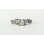 A modern diamond ring, in platinum, single stone with princess cut certificated diamond