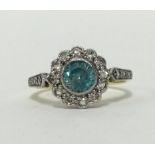 An 18ct blue zircon and diamond cluster ring, finger size M.