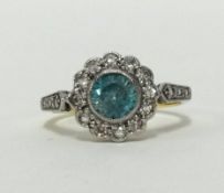 An 18ct blue zircon and diamond cluster ring, finger size M.
