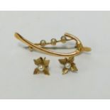 A 9ct and seed pearl set brooch, also a pair of similar earrings.