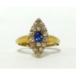 An 18ct sapphire and diamond cluster ring of boat shape, finger size Q, size approx 18mm x 9mm.