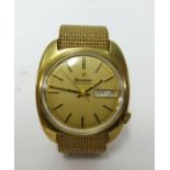 Bulova, a gents 9ct gold cased wristwatch day date with a 9ct Milanese bracelet, approx 74.5gms.