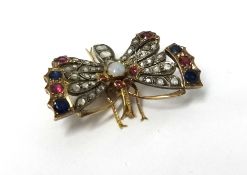 A fine antique butterfly brooch, set with diamonds, ruby's and sapphires and pearl,
