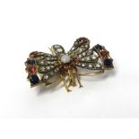 A fine antique butterfly brooch, set with diamonds, ruby's and sapphires and pearl,