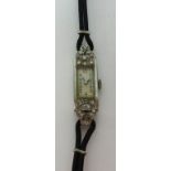 An Art Deco style ladies platinum and diamond set cocktail watch.