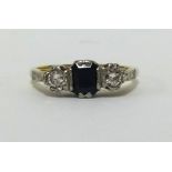 An 18ct sapphire and diamond three stone ring, finger size I.