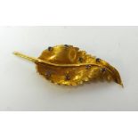 18ct gold leaf brooch, serrated edge and satin textured, 5.5cm x 2.5cm