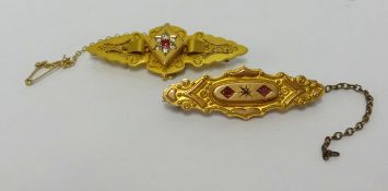 A Victorian 9ct plaque brooch set with ruby and diamonds, approx 3.8gms and another similar brooch