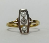 A pearl and diamond set three stone ring in yellow metal, finger size P.