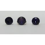 A 14k gold amethyst coloured stone set ring and a pair of similar earrings.