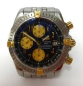 Breitling, a gents stainless steel and gilt chronograph, automatic with date, back plate number
