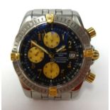 Breitling, a gents stainless steel and gilt chronograph, automatic with date, back plate number