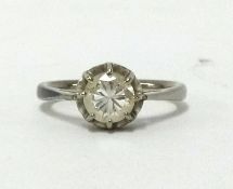 Solitaire diamond ring, only slightly off round modern brilliant cut diamond,