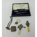 Mixed lot, silver vesta, guard chain, three teethers/rattles, cased silver, spoon and pushers.