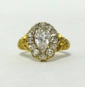 An Antique pear cut diamond cluster ring in 18ct gold, finger size J.