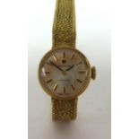 Tissot, a ladies 9ct gold wristwatch approx 16gms.