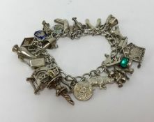 A silver charm bracelet, approx 56gms.