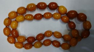 An Amber butterscotch/yellow necklace. 93.2grms.