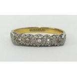 An 18ct yellow gold and five stone diamond ring, finger size P.