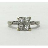 A fine 18ct white gold diamond ring set with four bright princess cut diamonds.