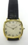 Cartier, a gents 18ct gold automatic wristwatch, the engine turned dial set with roman numerals on a